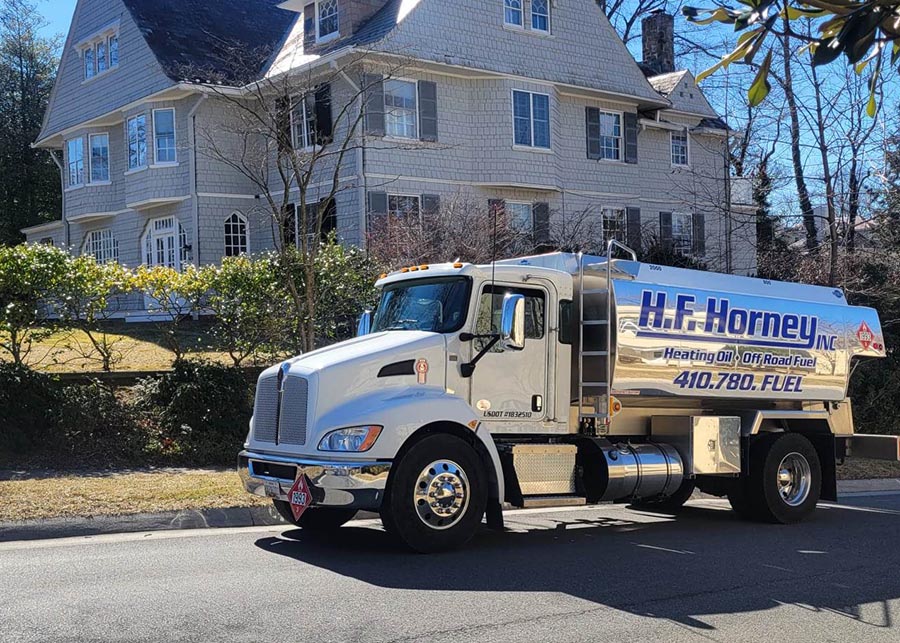 residential fuel delivery truck at a home